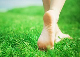 Barefoot running on the grass